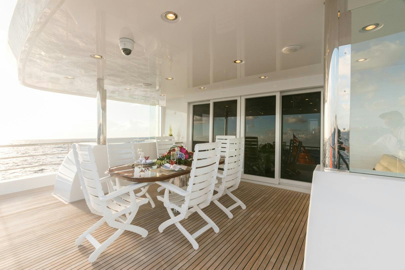 a room with a table and chairs aboard MY AURORA Yacht for Sale