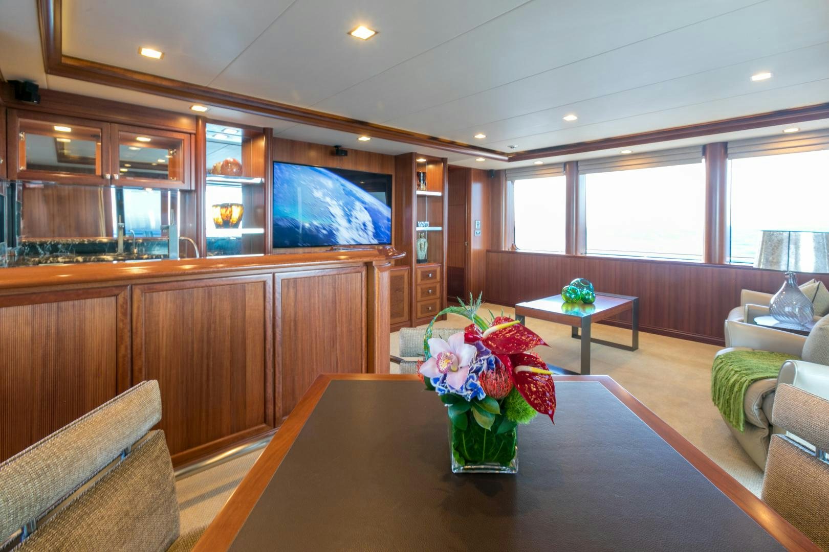 a vase of flowers on a table aboard MY AURORA Yacht for Sale
