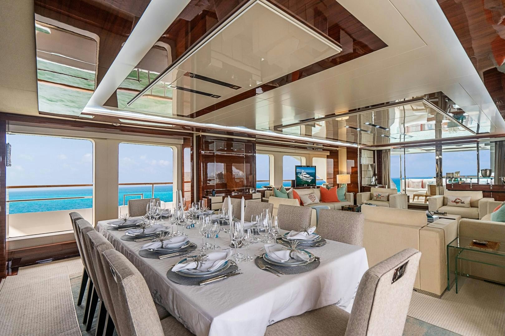 a large room with tables and chairs aboard No Name Yacht for Sale