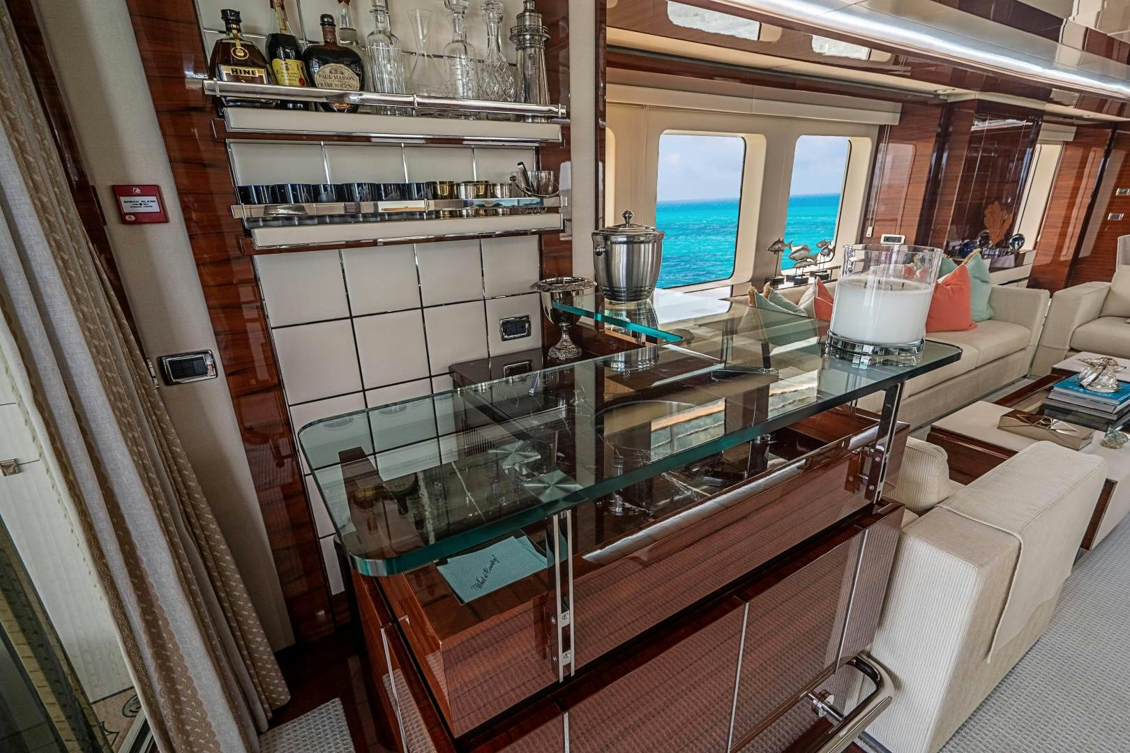a kitchen with a glass table aboard No Name Yacht for Sale
