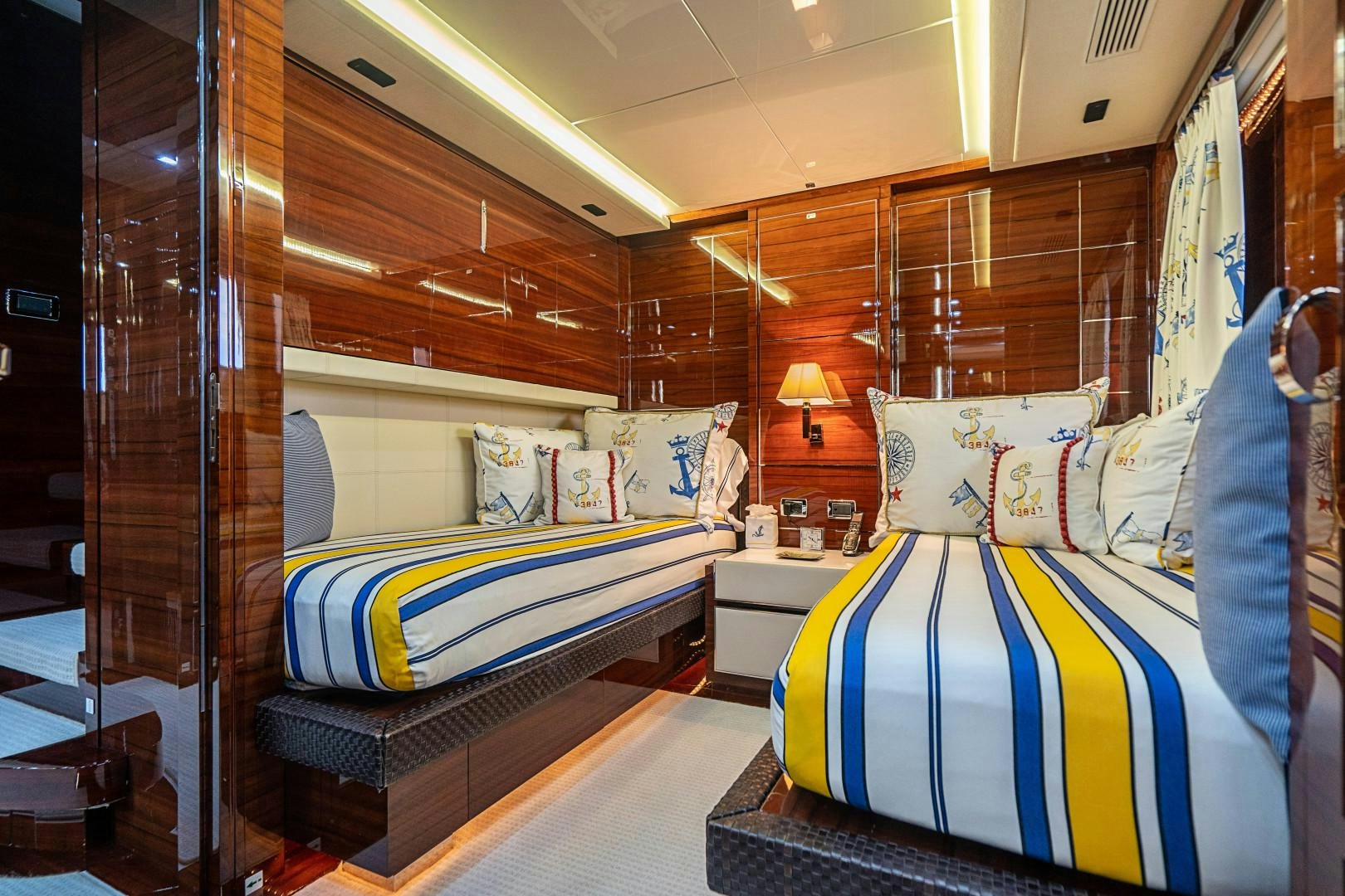 a room with a bed and a mirror aboard No Name Yacht for Sale