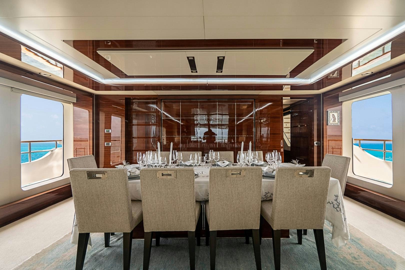 a room with a table and chairs aboard No Name Yacht for Sale