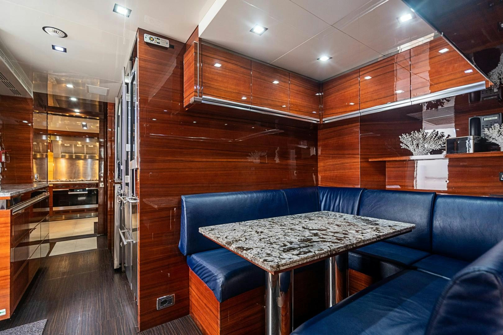 a room with a table and chairs aboard No Name Yacht for Sale