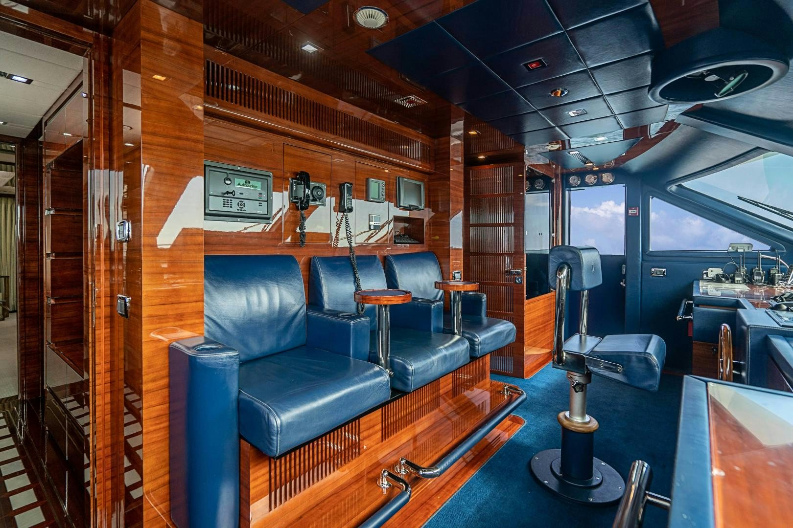 a room with a couch and a television aboard No Name Yacht for Sale