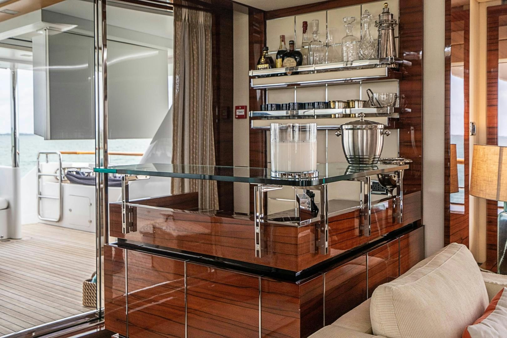 a glass display case in a room aboard No Name Yacht for Sale