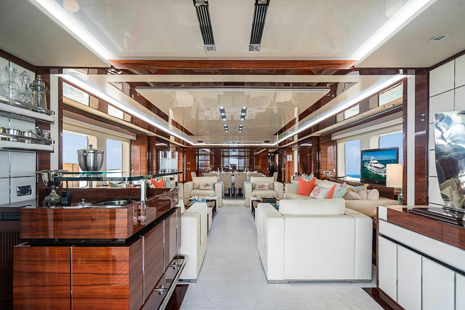 a room with a couch and a tv aboard No Name Yacht for Sale
