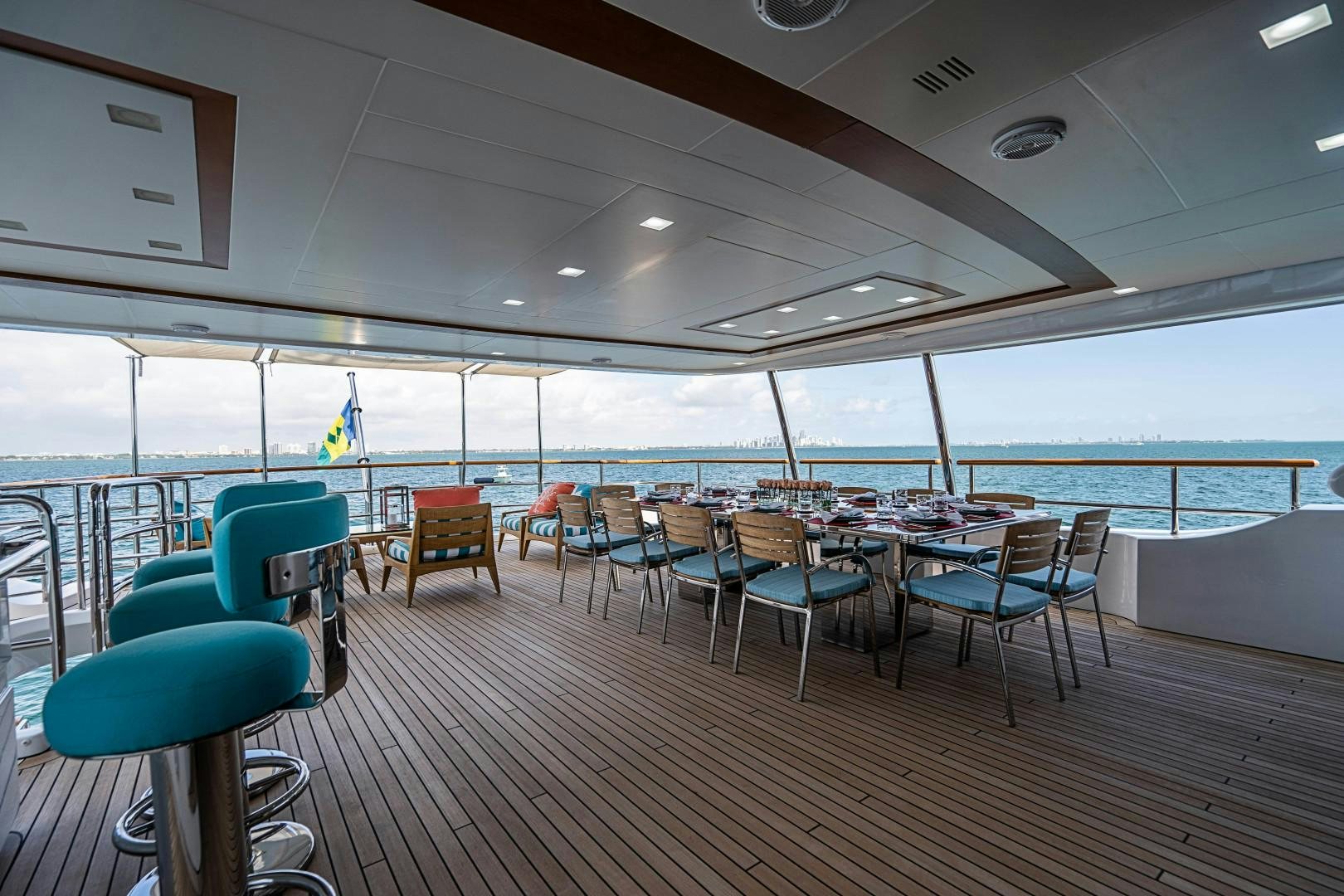 a room with a table and chairs aboard No Name Yacht for Sale