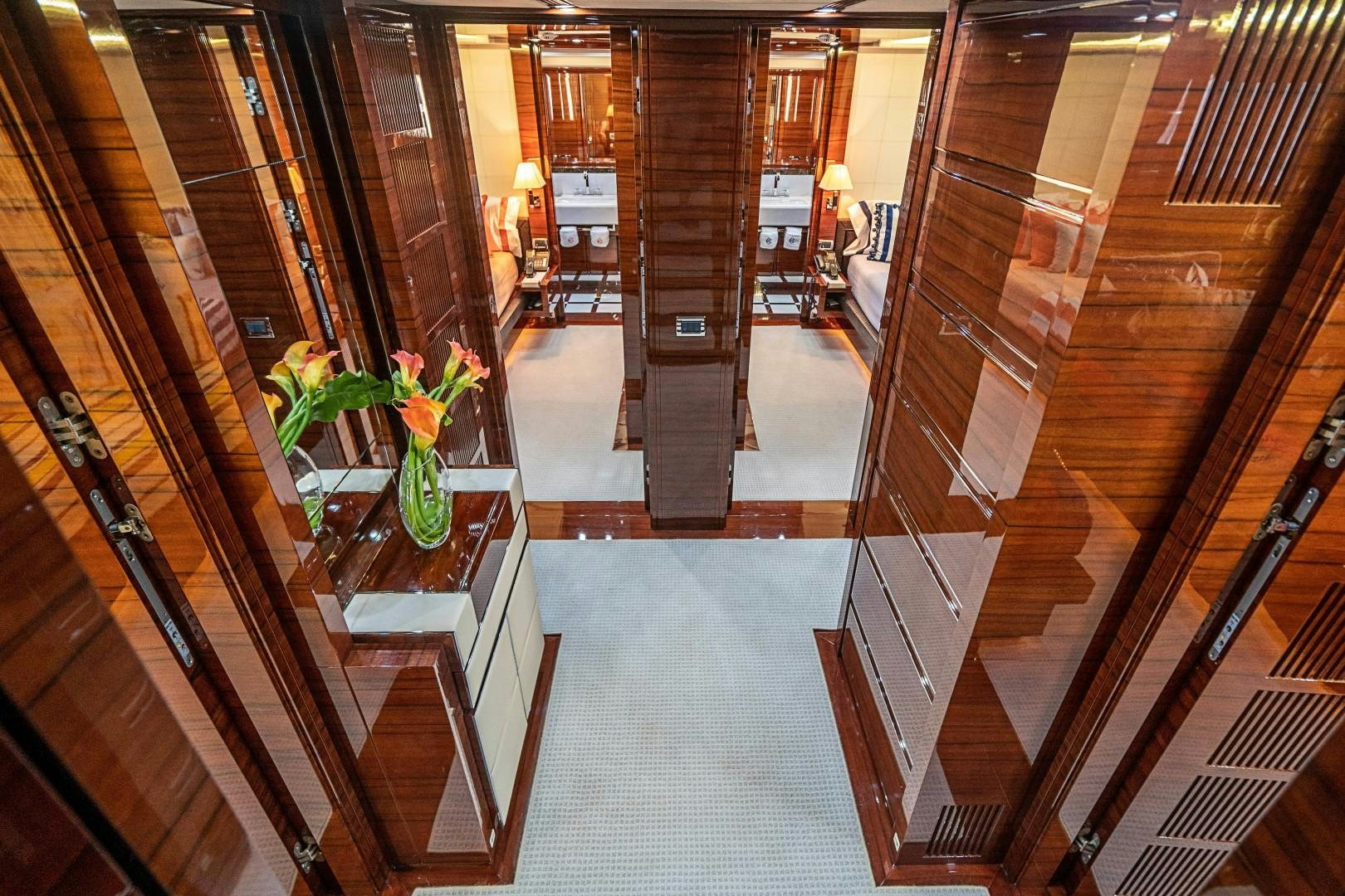 a hallway with glass doors aboard No Name Yacht for Sale