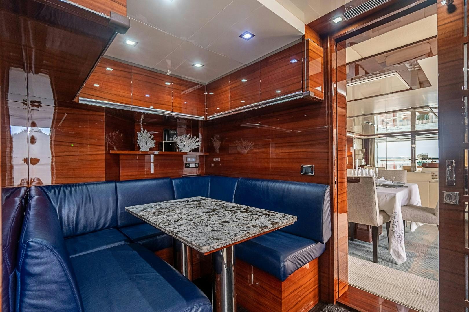 a room with a table and chairs aboard No Name Yacht for Sale