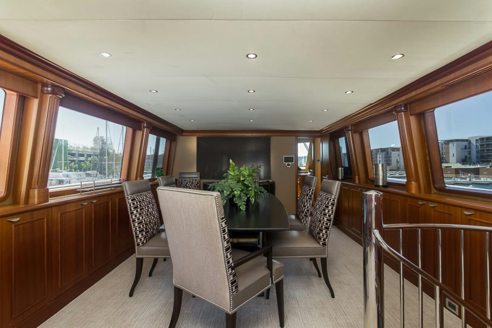a dining room with a table and chairs aboard LIQUIDITY Yacht for Sale