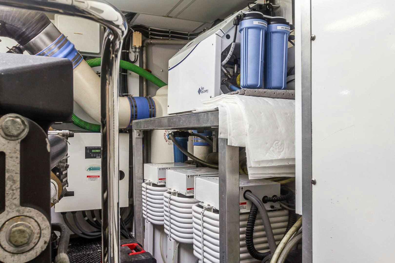 a machine with a large stack of white containers aboard LIQUIDITY Yacht for Sale