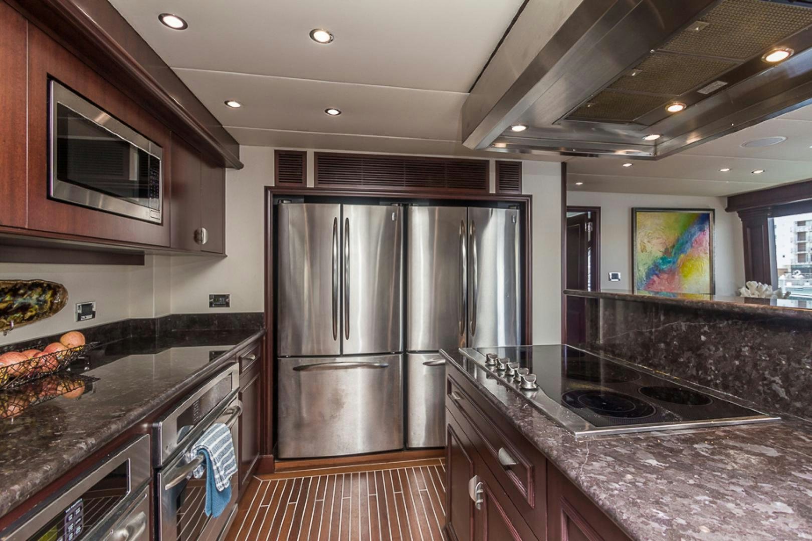 a kitchen with stainless steel appliances aboard LIQUIDITY Yacht for Sale