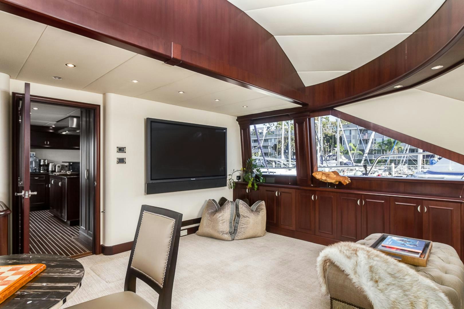 a living room with a large tv aboard LIQUIDITY Yacht for Sale