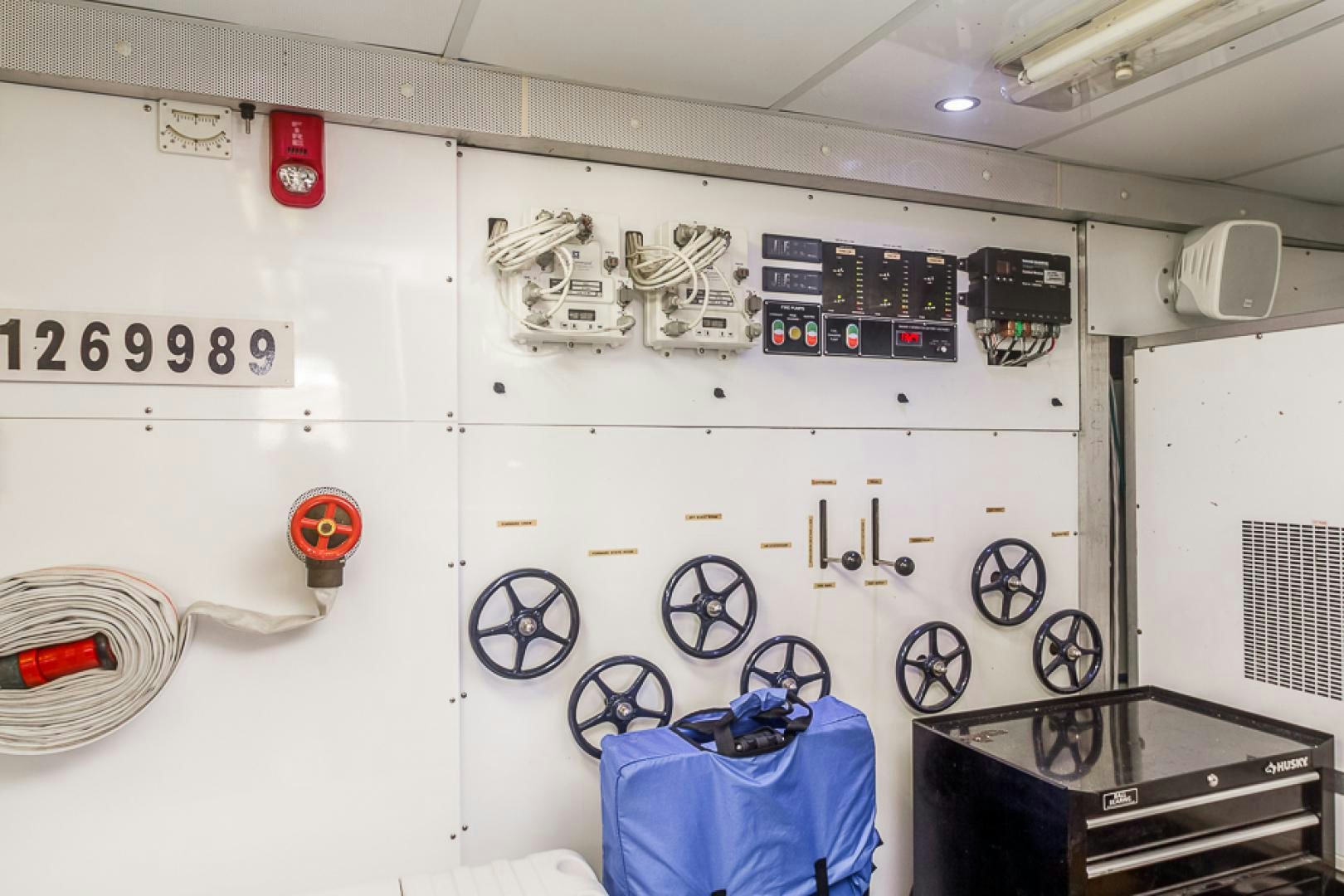a white wall with a white wall with a white wall and a blue basket and a basket with aboard LIQUIDITY Yacht for Sale
