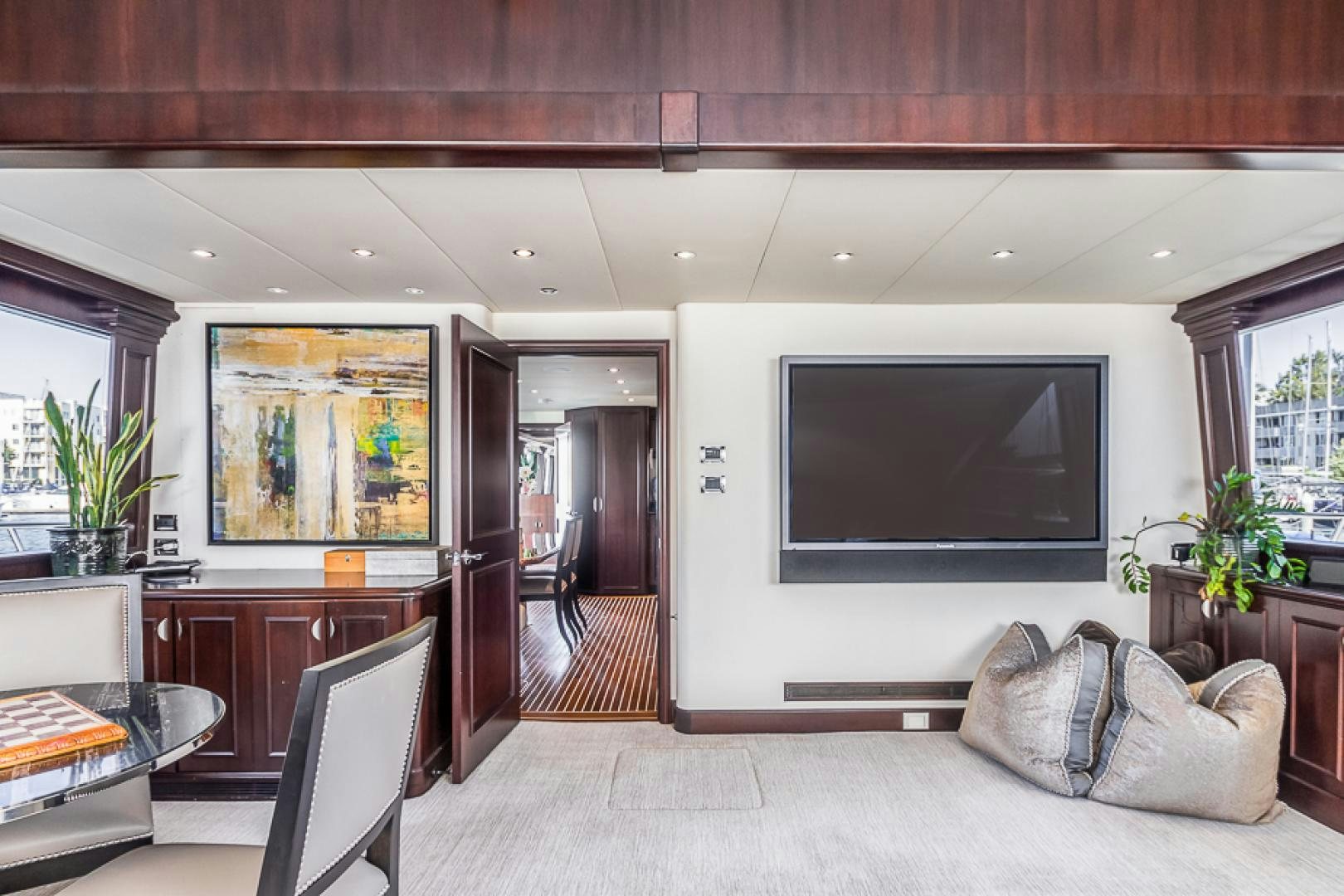 a living room with a large television aboard LIQUIDITY Yacht for Sale