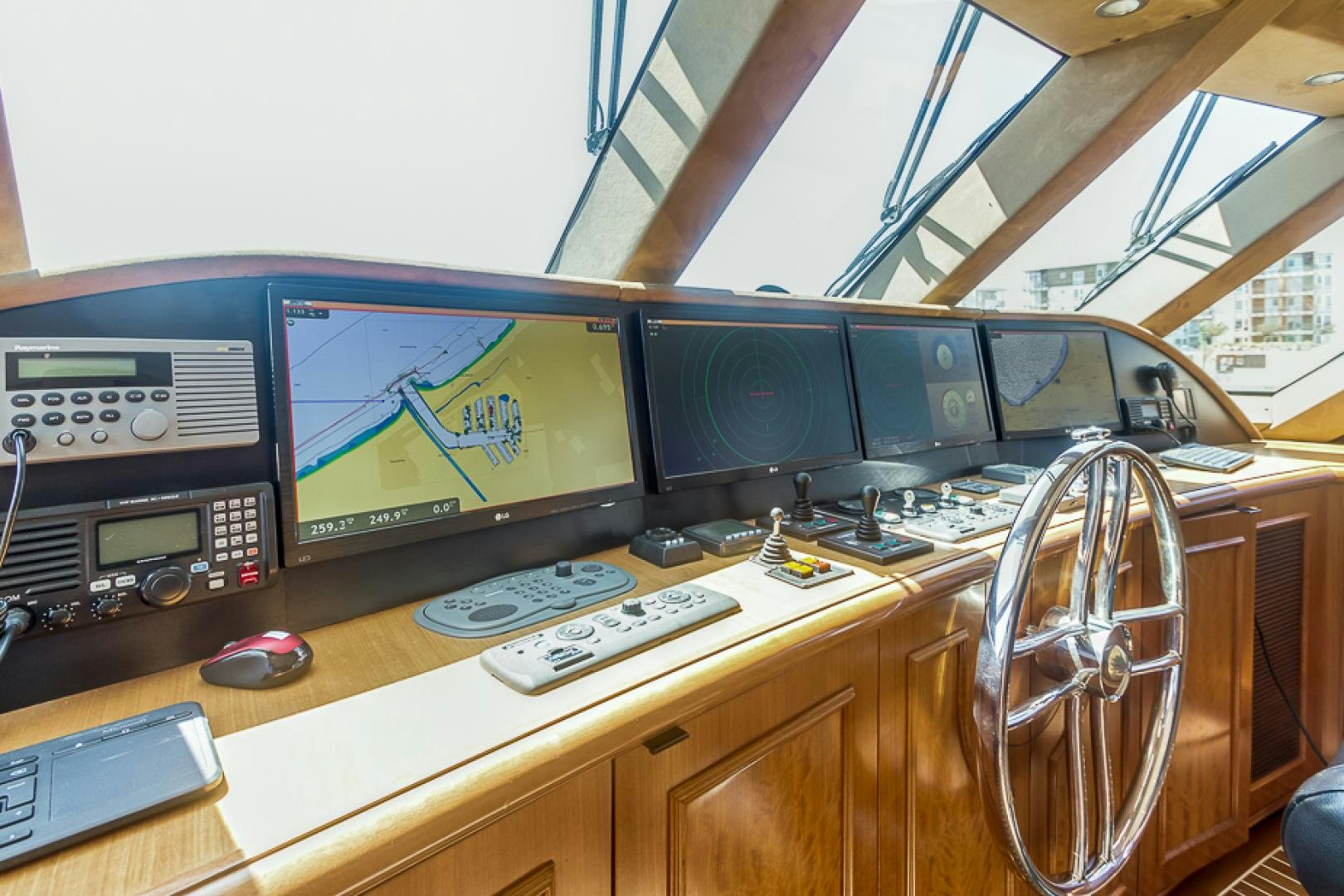 a group of monitors on a table aboard LIQUIDITY Yacht for Sale