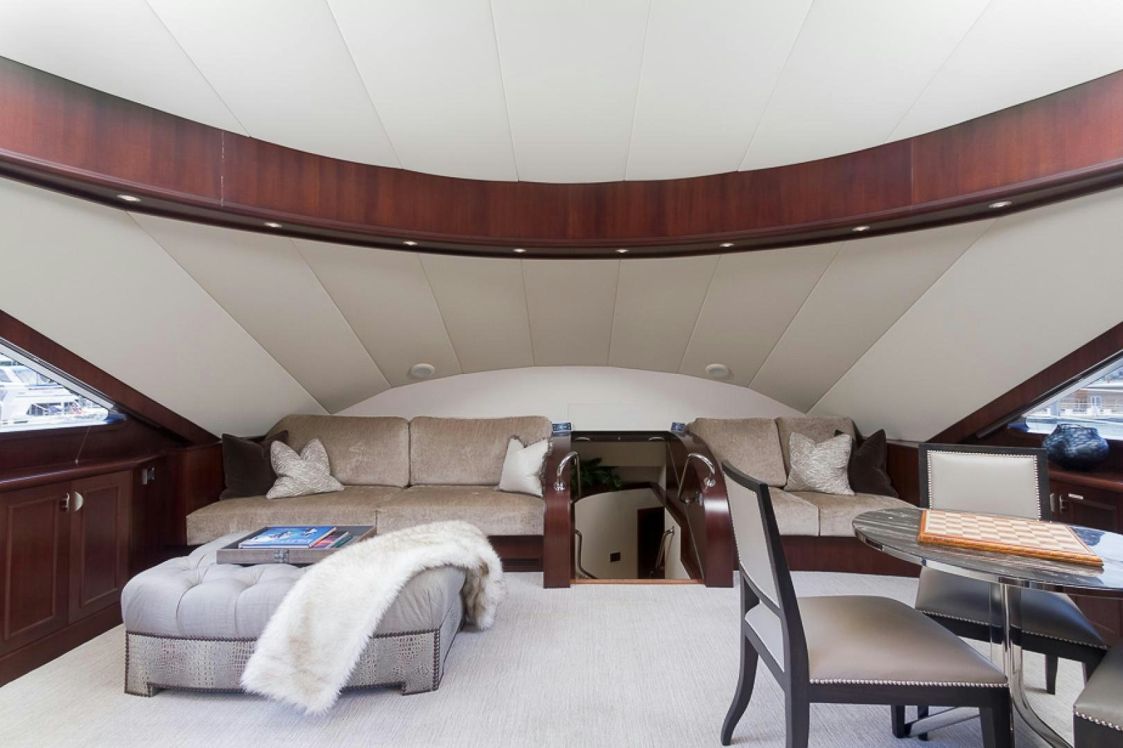 a bed with a white blanket on it aboard LIQUIDITY Yacht for Sale