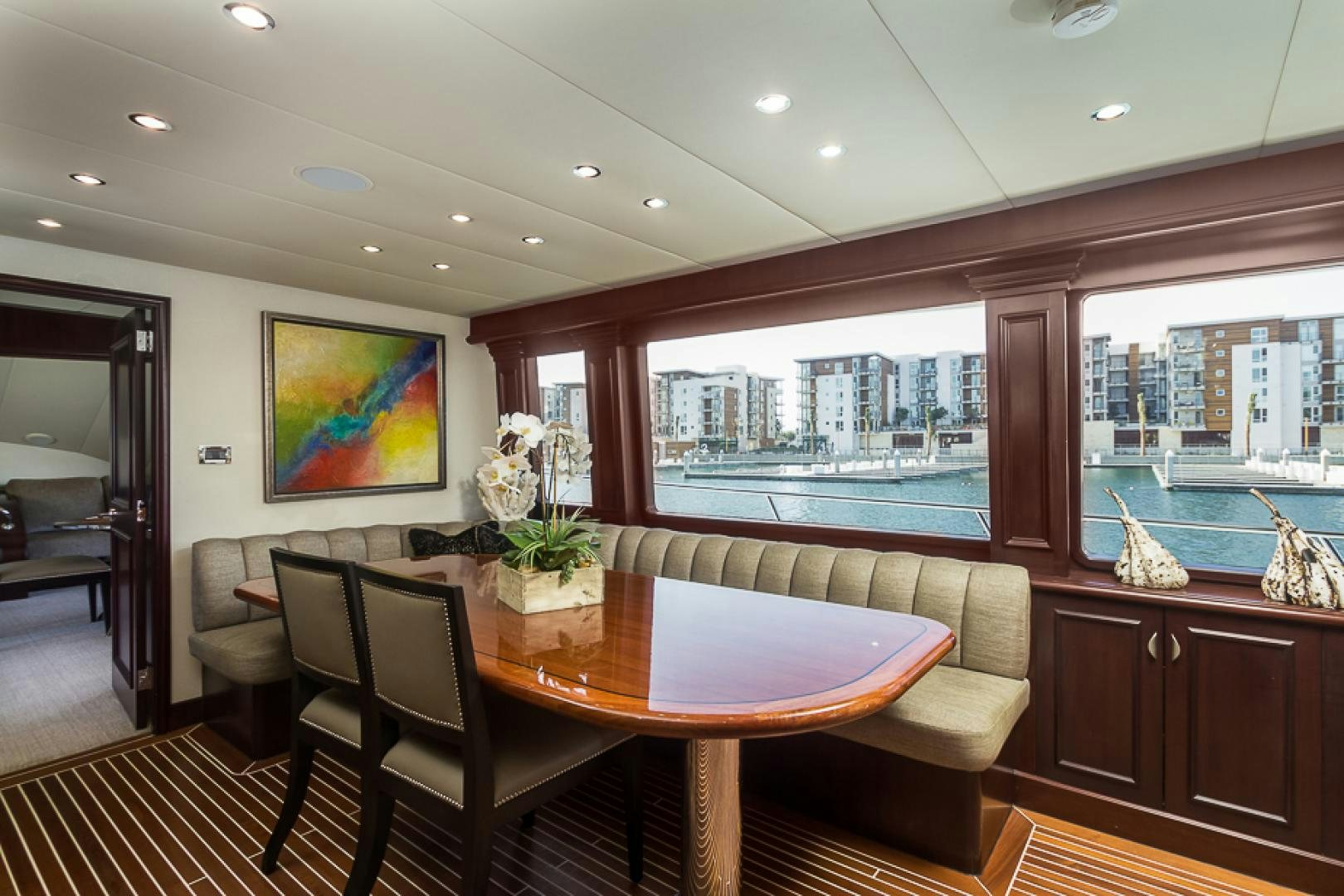 a dining room with a table and chairs aboard LIQUIDITY Yacht for Sale