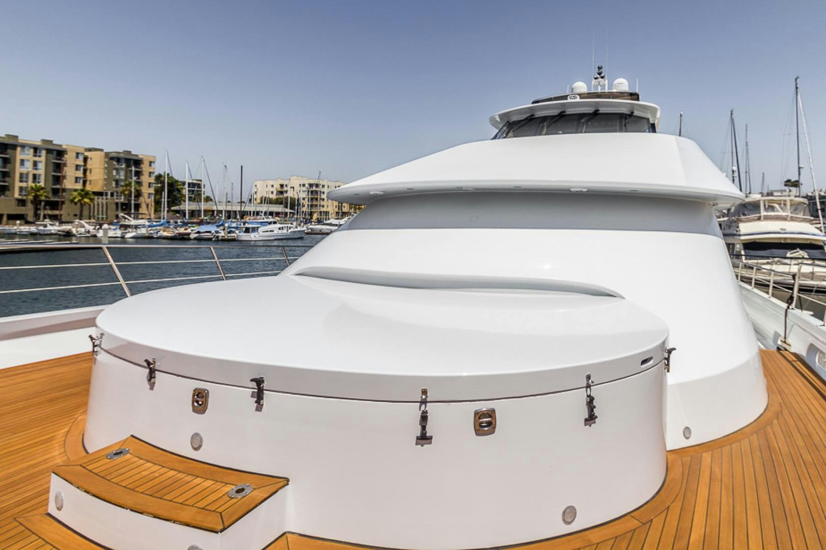 a white boat in a harbor aboard LIQUIDITY Yacht for Sale