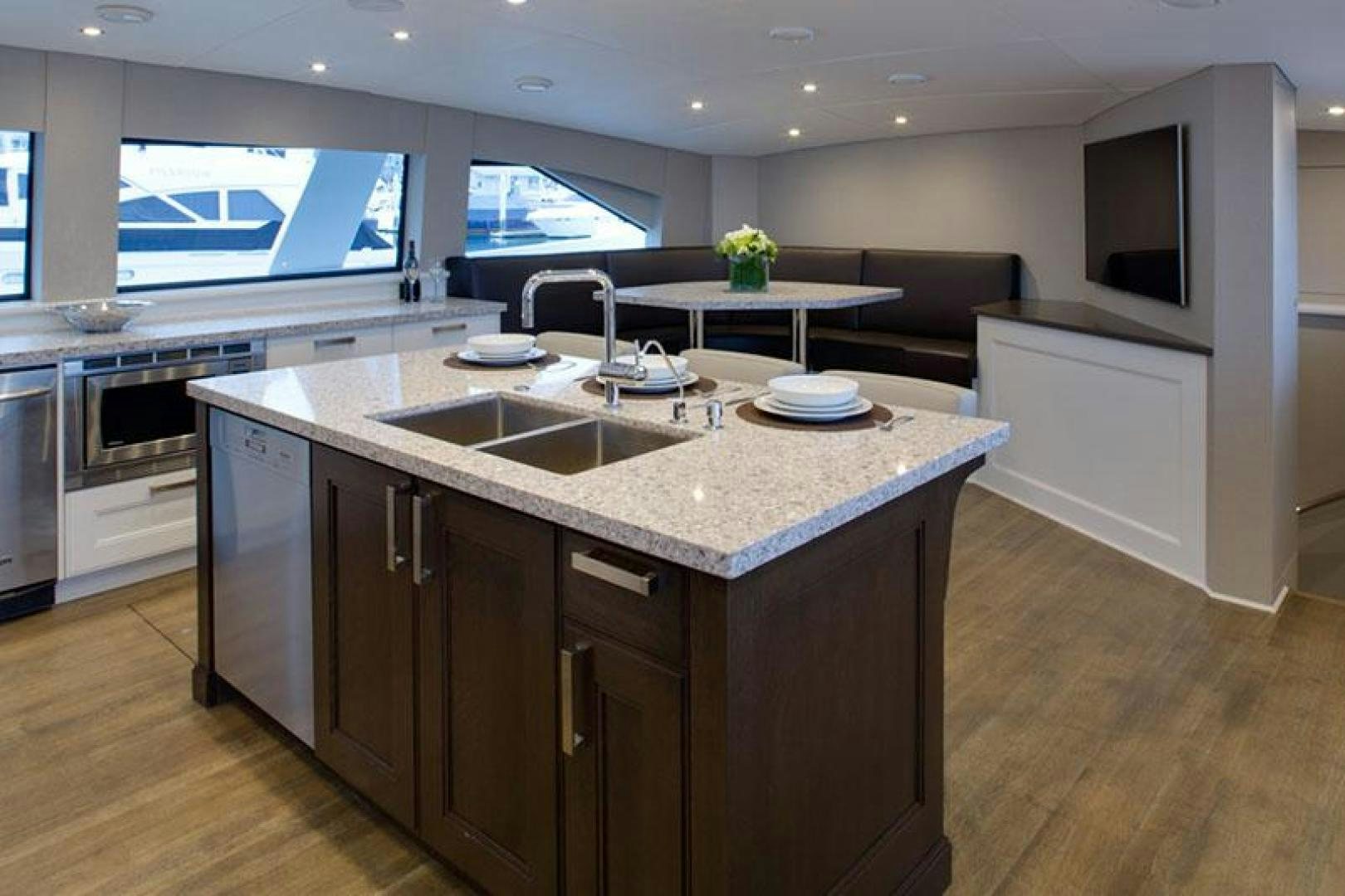 a kitchen with a large island aboard ENCORE Yacht for Sale