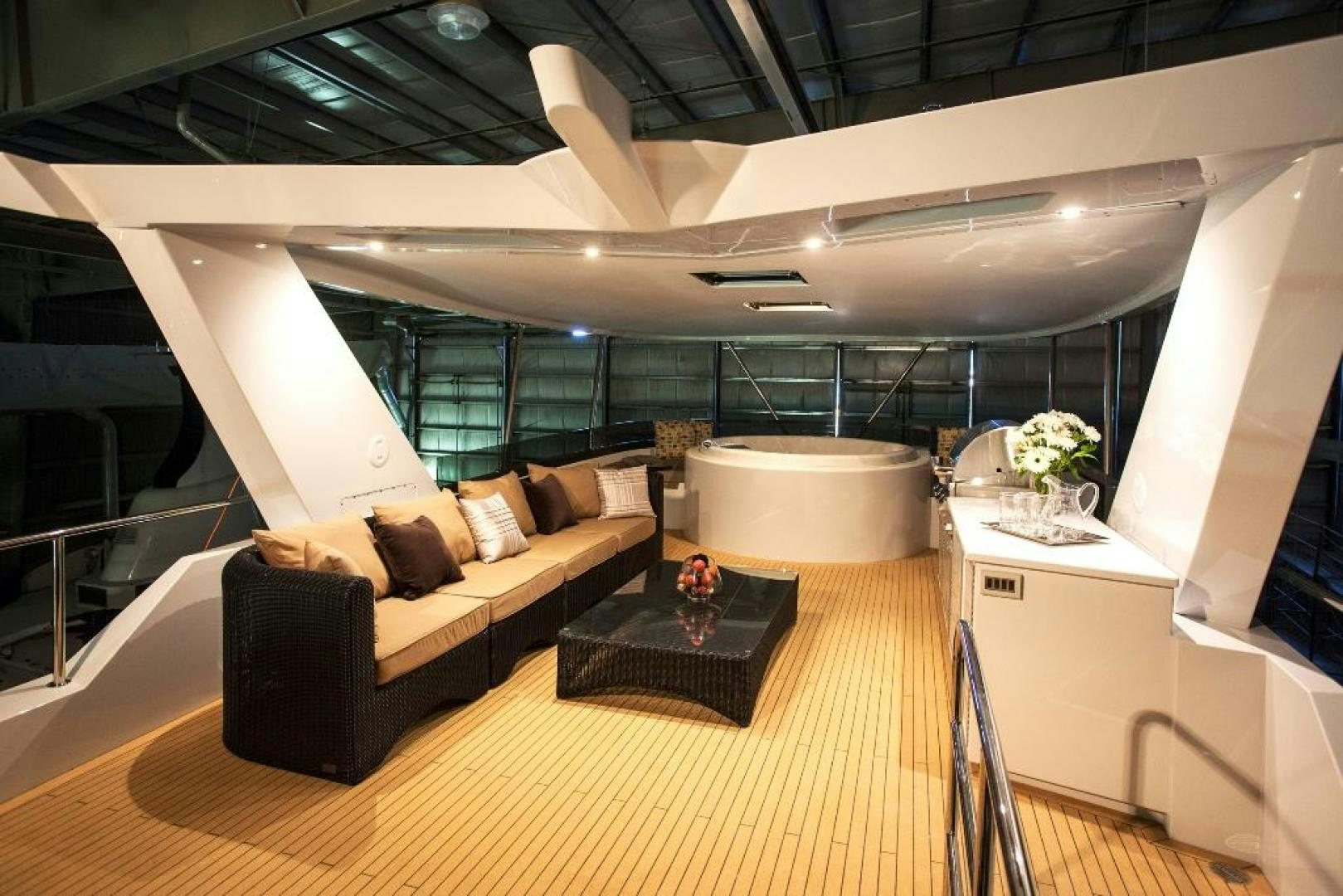 a room with a couch and a table aboard ENCORE Yacht for Sale