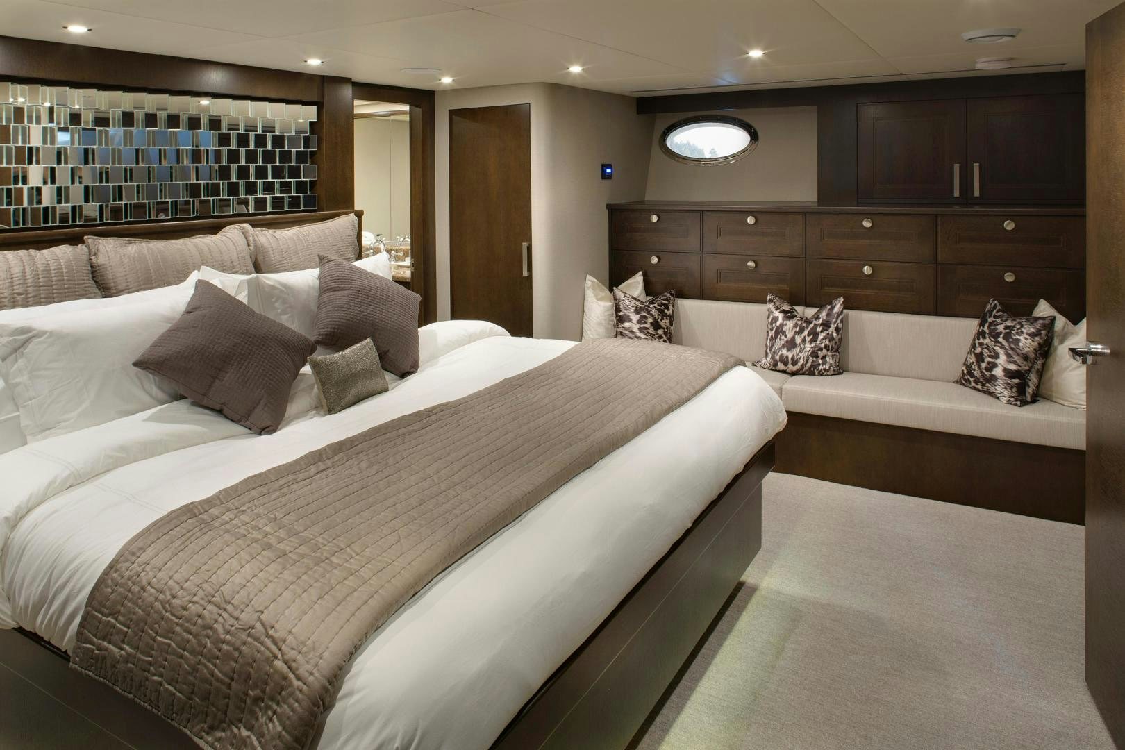 a room with a bed and a couch aboard ENCORE Yacht for Sale