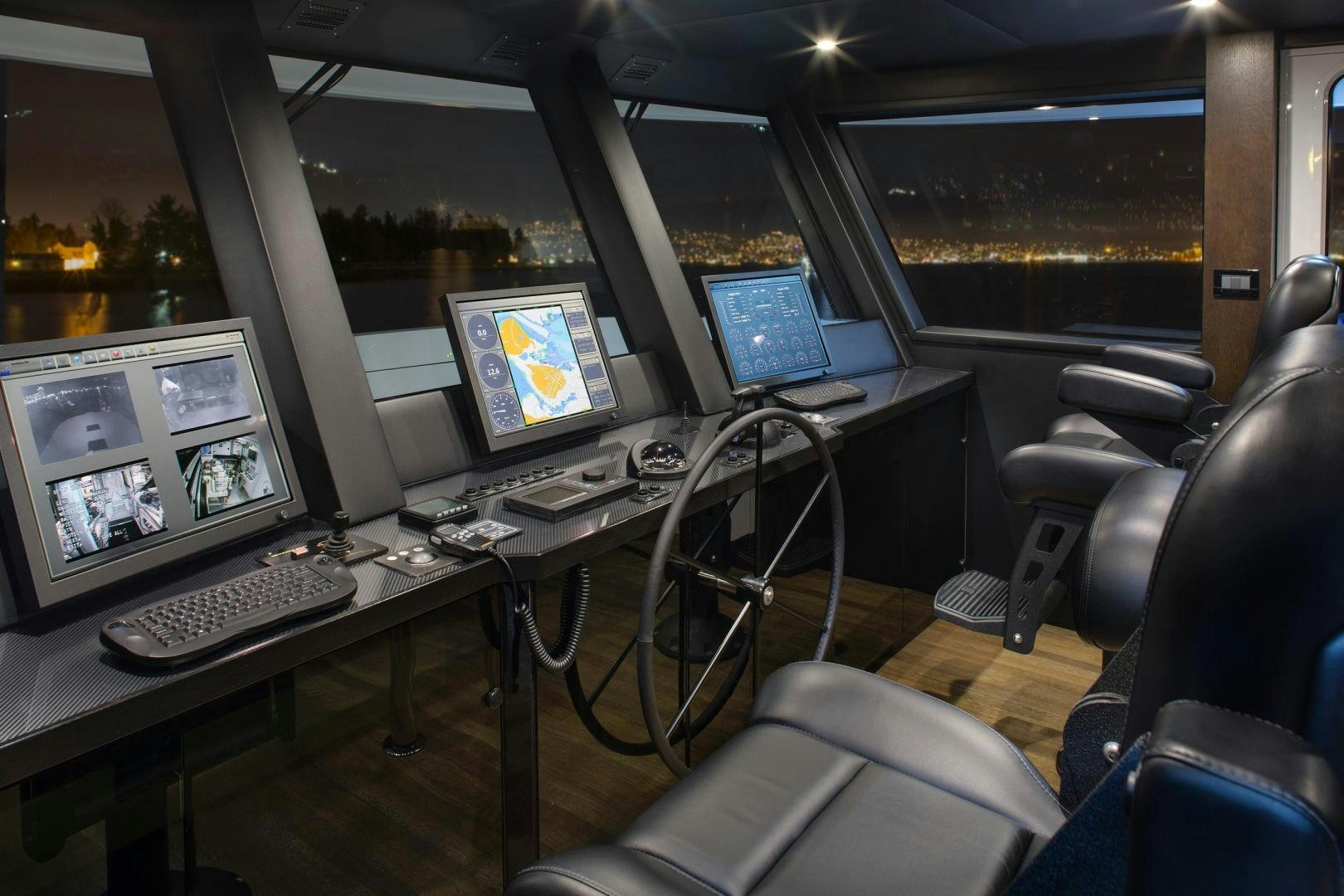 a room with computers and monitors aboard ENCORE Yacht for Sale
