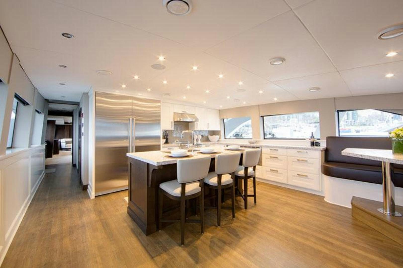 a kitchen with a large island aboard ENCORE Yacht for Sale