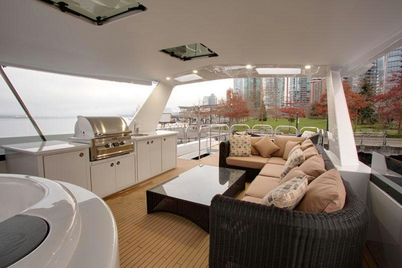 a living room with a large window aboard ENCORE Yacht for Sale