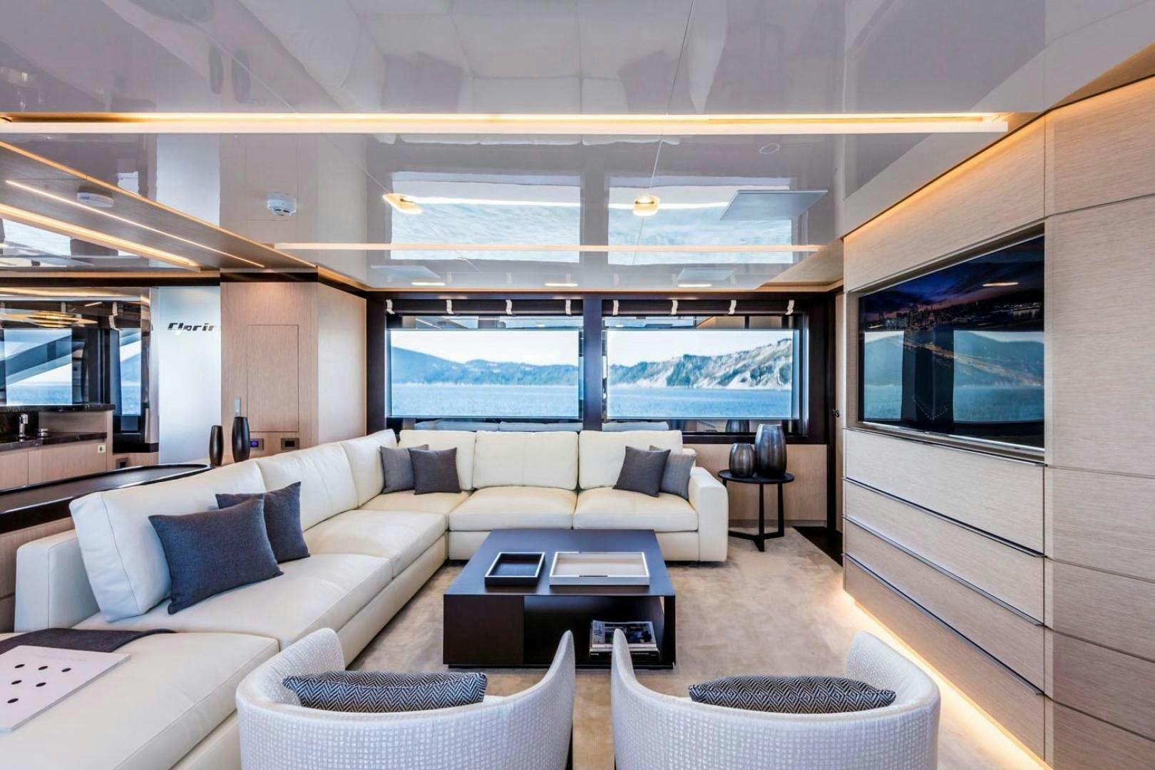 a living room with a large window aboard CLORINDA Yacht for Sale