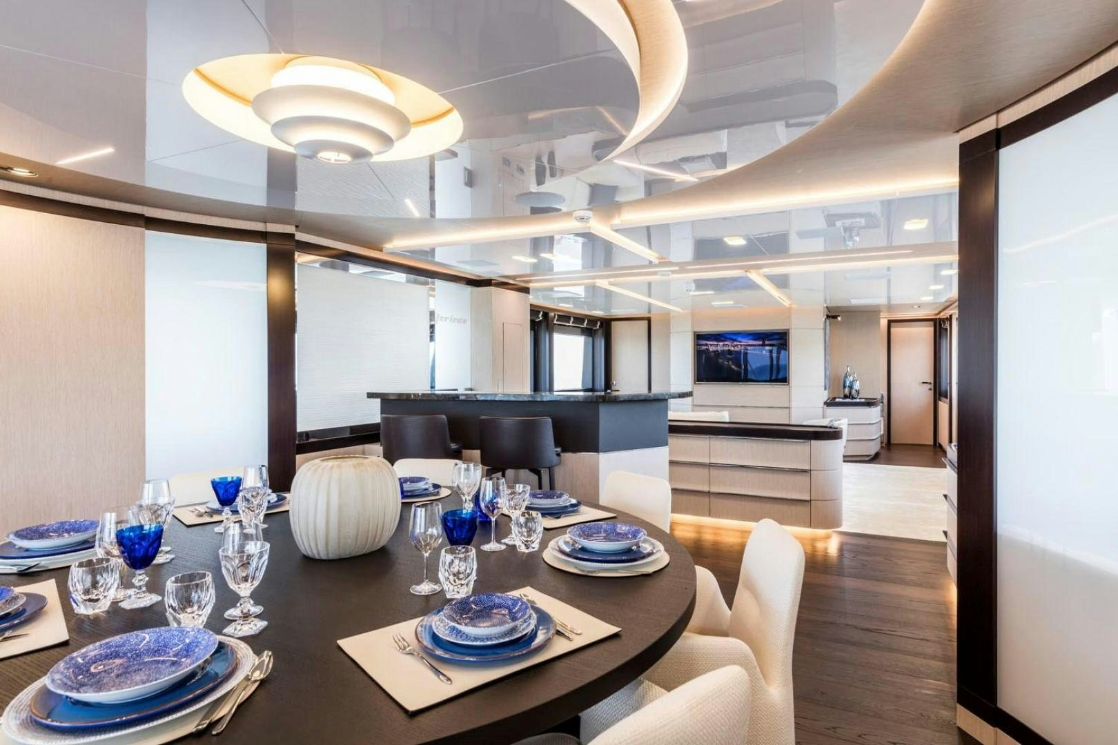 a dining room with a table set aboard CLORINDA Yacht for Sale