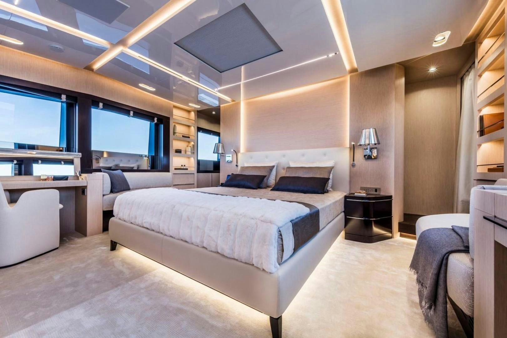 a room with a bed and a desk aboard CLORINDA Yacht for Sale