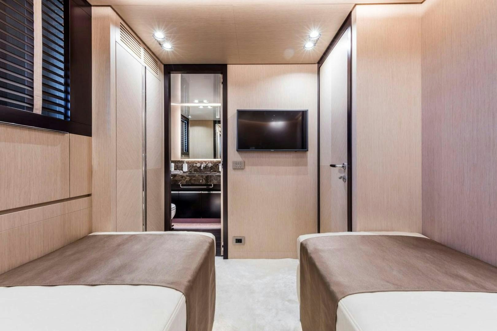 a room with a tv and a bed aboard CLORINDA Yacht for Sale