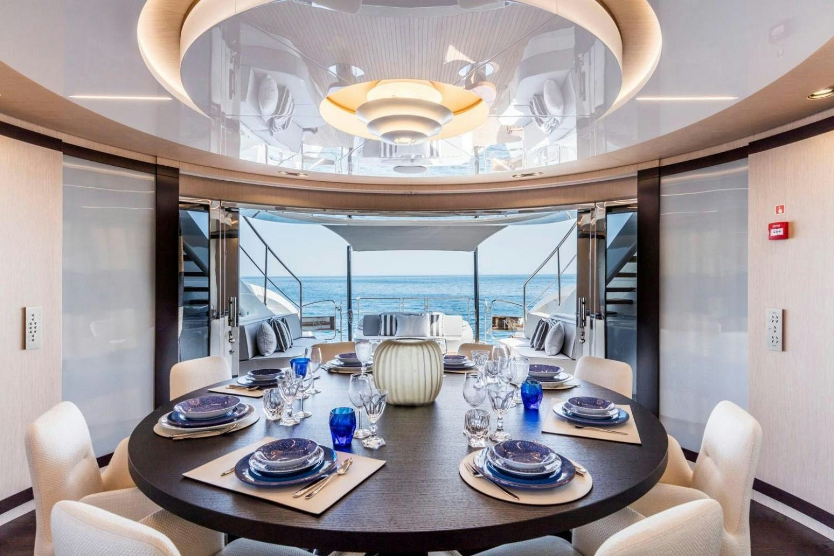 a dining room with a large mirror aboard CLORINDA Yacht for Sale