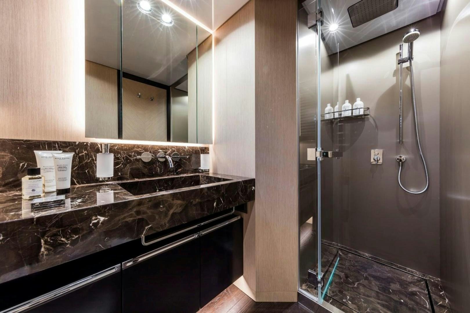 a bathroom with a large mirror aboard CLORINDA Yacht for Sale