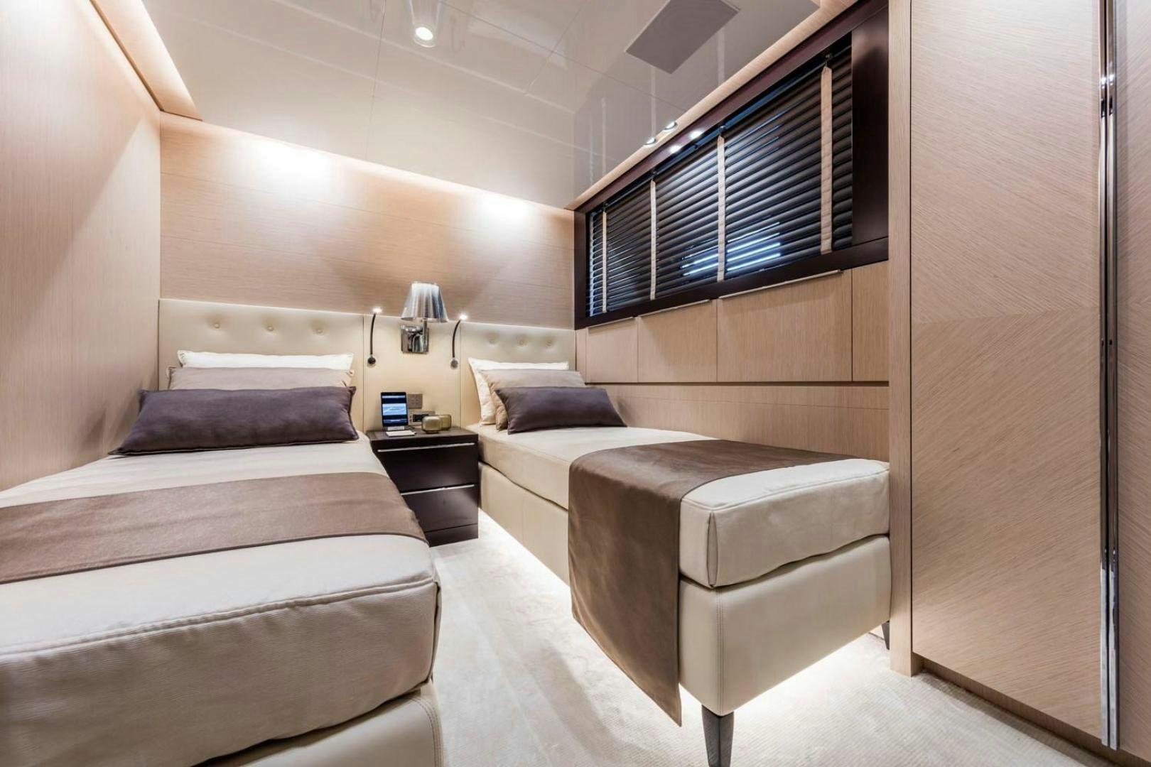 a room with a bed and a desk aboard CLORINDA Yacht for Sale