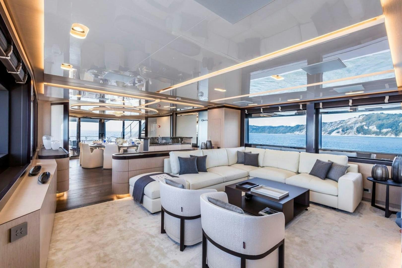 a living room with a large window aboard CLORINDA Yacht for Sale