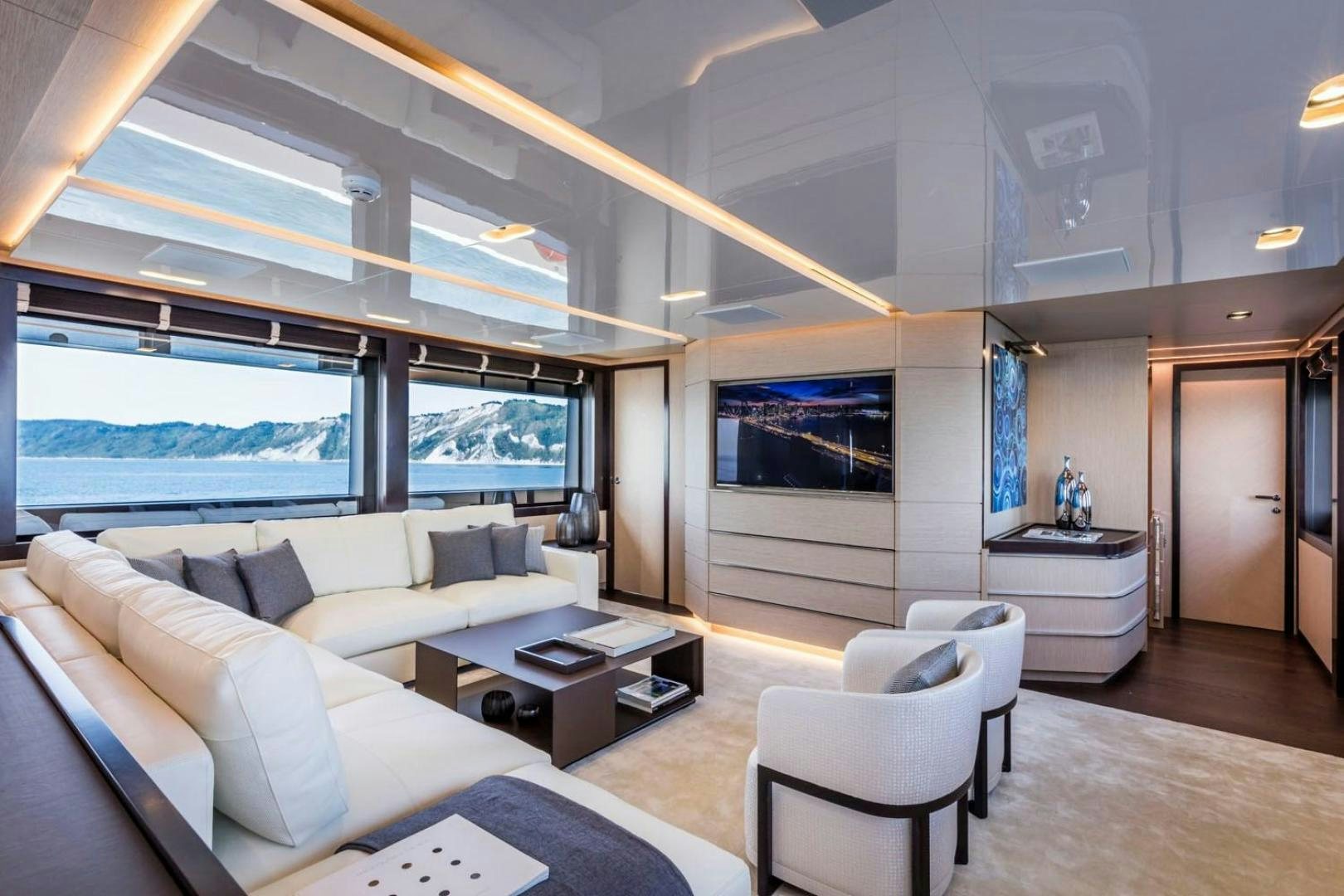 a living room with a large window aboard CLORINDA Yacht for Sale