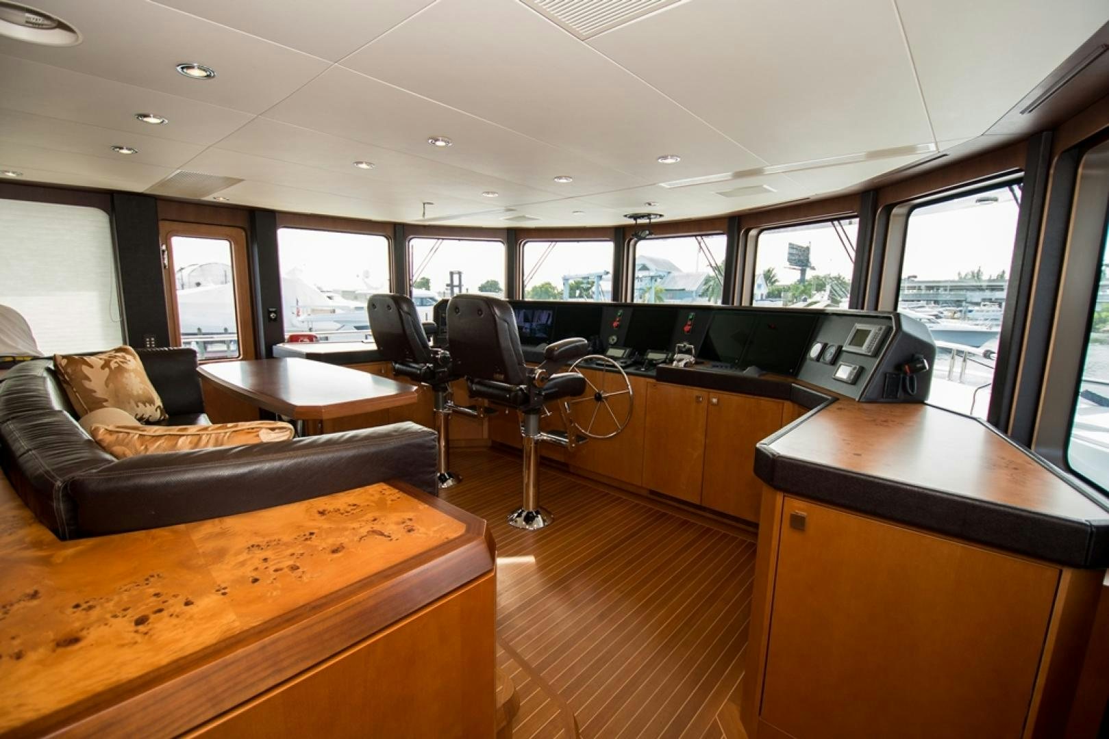 a room with a couch and a table and a chair aboard DREAM WEAVER Yacht for Sale
