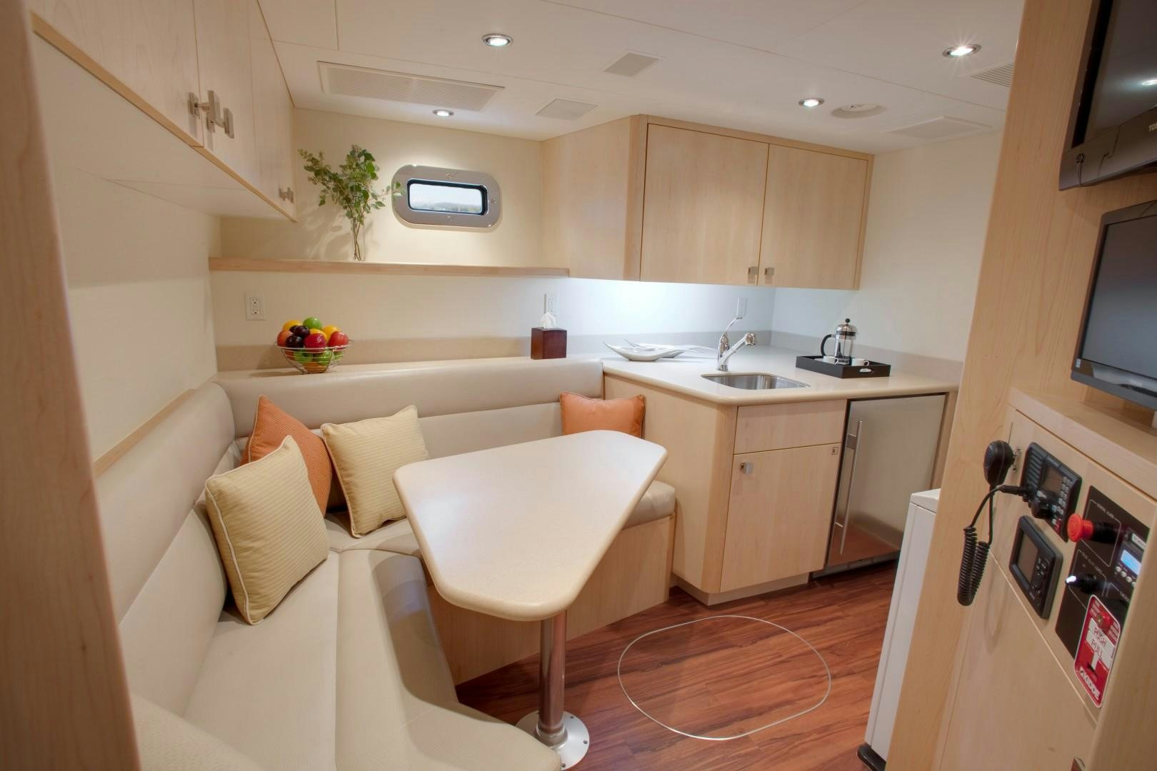a kitchen with a white couch aboard DREAM WEAVER Yacht for Sale