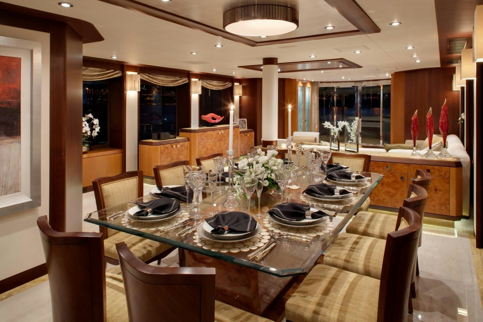 a large dining table in a large room aboard DREAM WEAVER Yacht for Sale