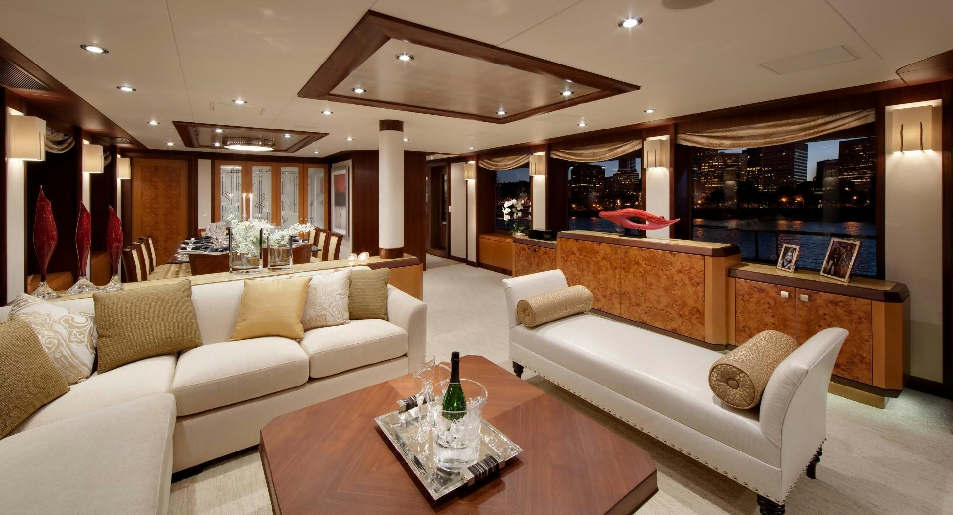 a living room with a table and couches aboard DREAM WEAVER Yacht for Sale