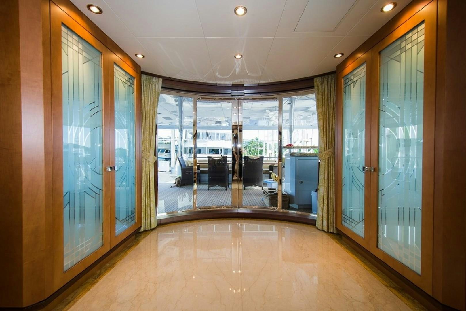 a large room with glass walls aboard DREAM WEAVER Yacht for Sale