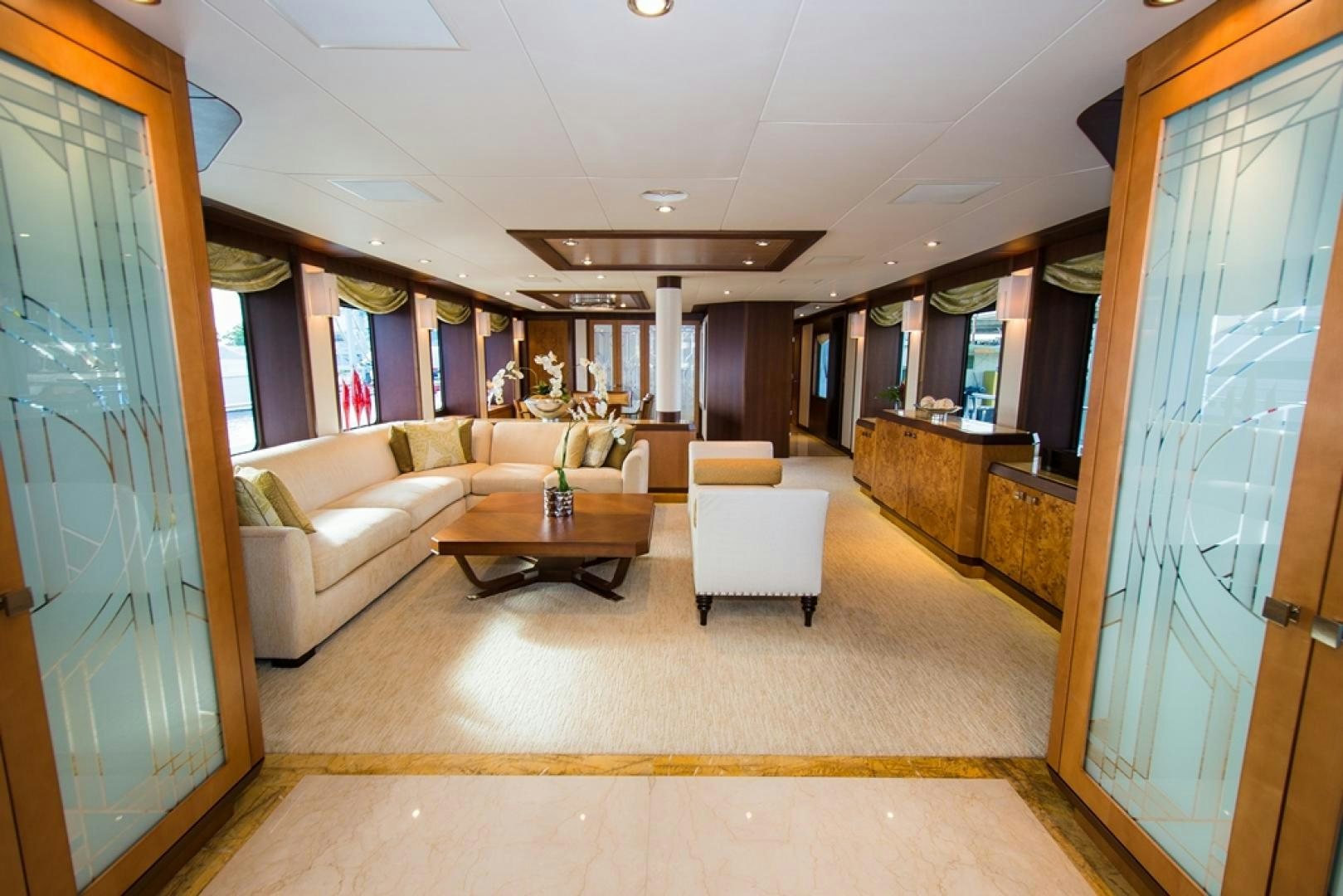 a living room with a couch and a coffee table aboard DREAM WEAVER Yacht for Sale