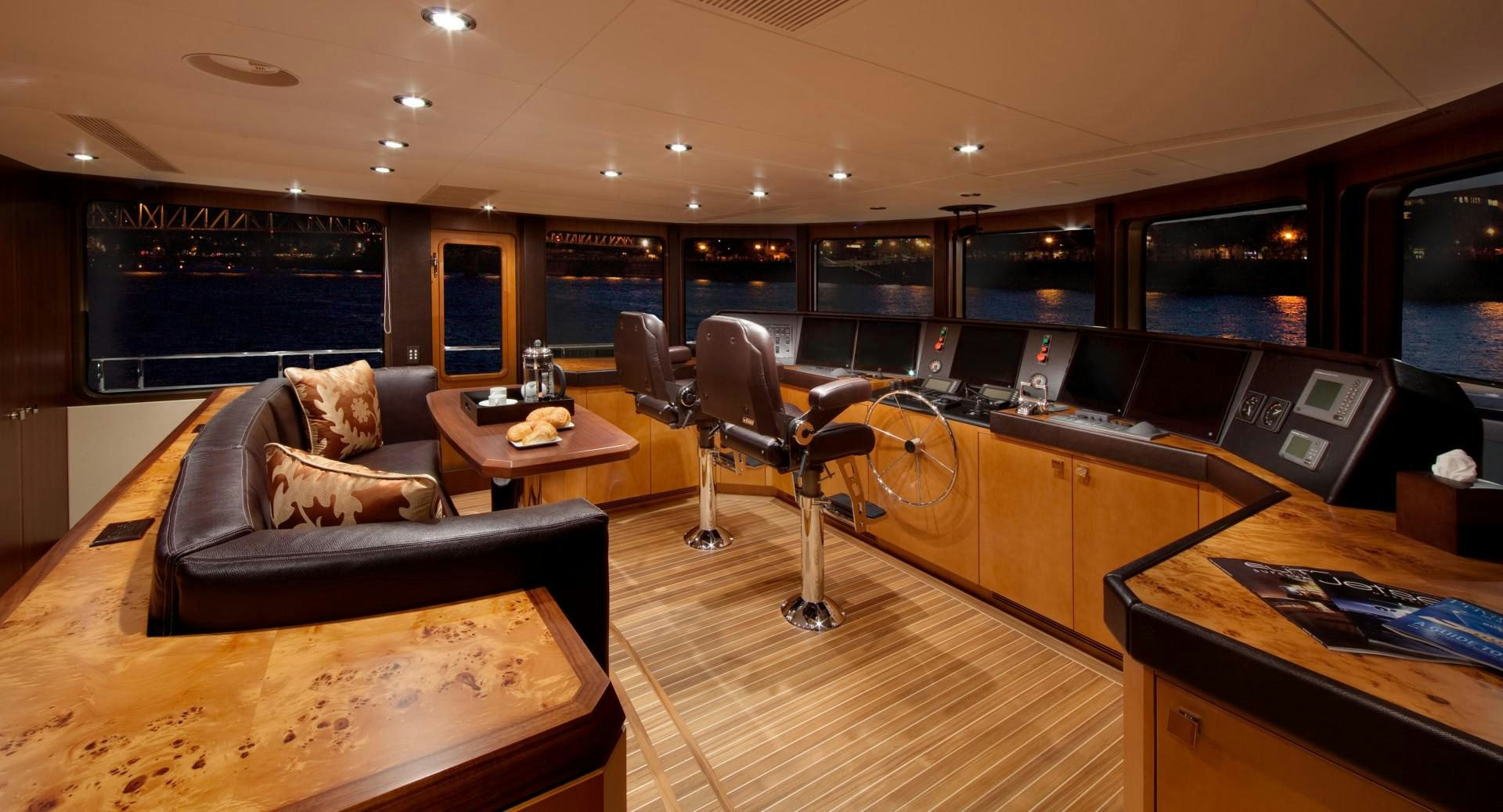 a room with a couch and a table and a tv aboard DREAM WEAVER Yacht for Sale