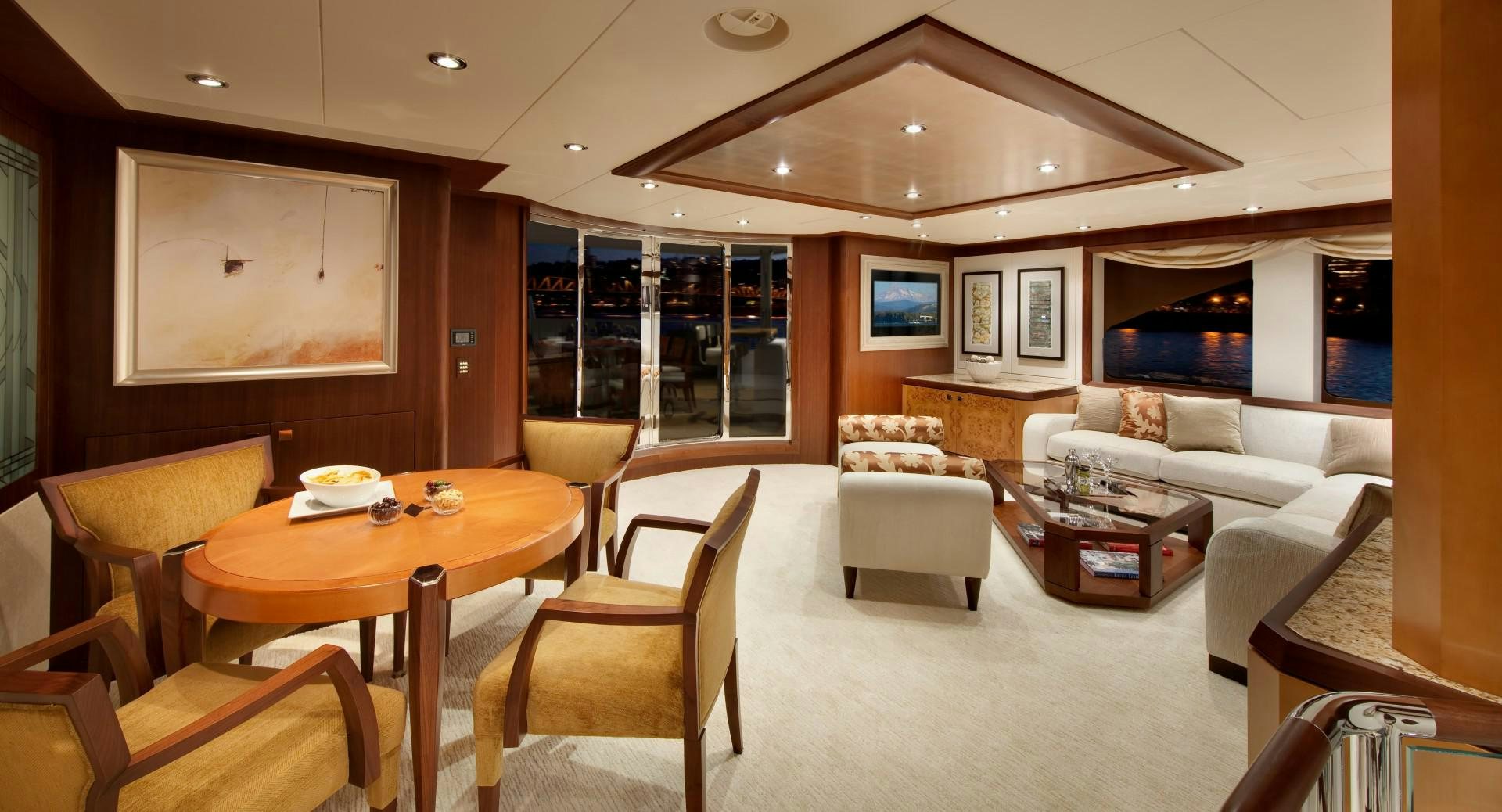 a living room with a table and chairs aboard DREAM WEAVER Yacht for Sale