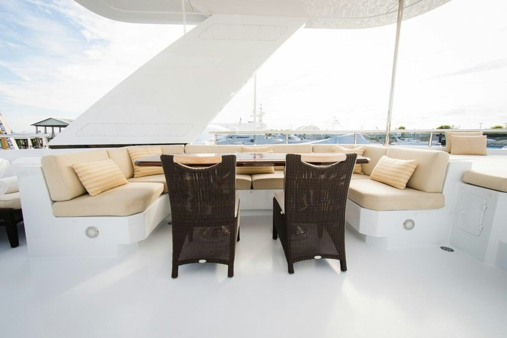 a room with a table and chairs aboard DREAM WEAVER Yacht for Sale