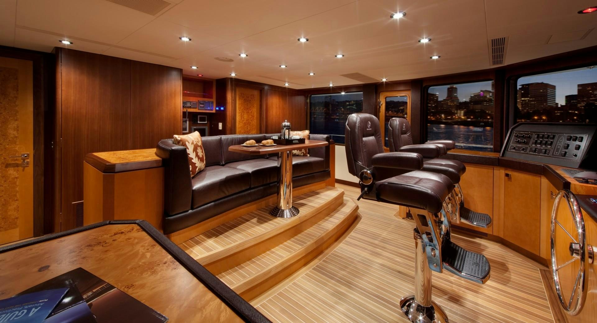 a room with a couch and a table aboard DREAM WEAVER Yacht for Sale
