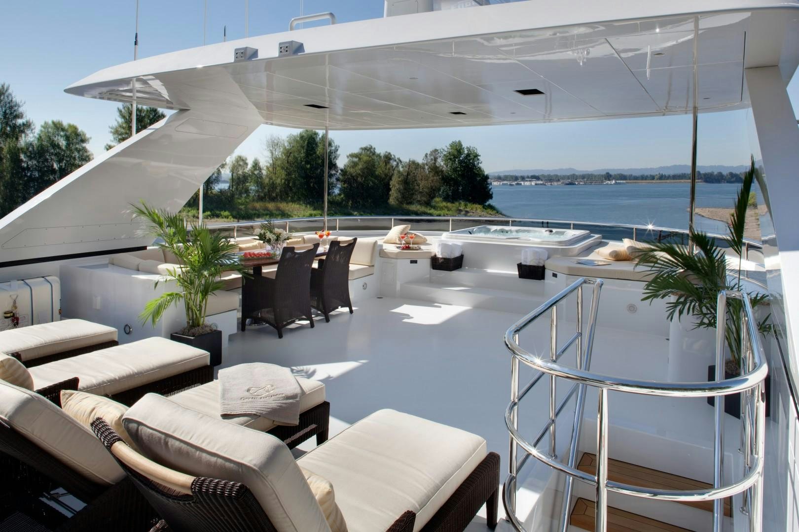 a patio with a table and chairs aboard DREAM WEAVER Yacht for Sale