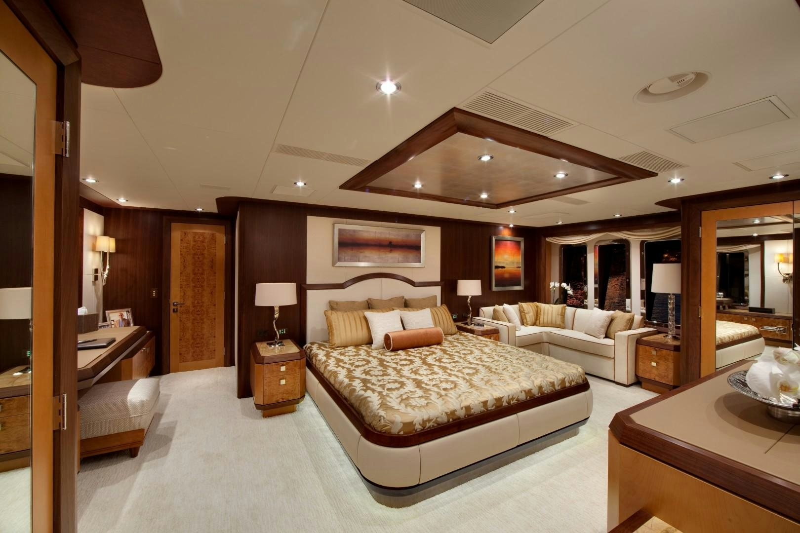 a large bedroom with a large bed aboard DREAM WEAVER Yacht for Sale